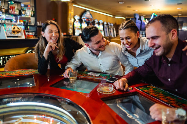 Live casino studio with multiple dealers and bright lighting